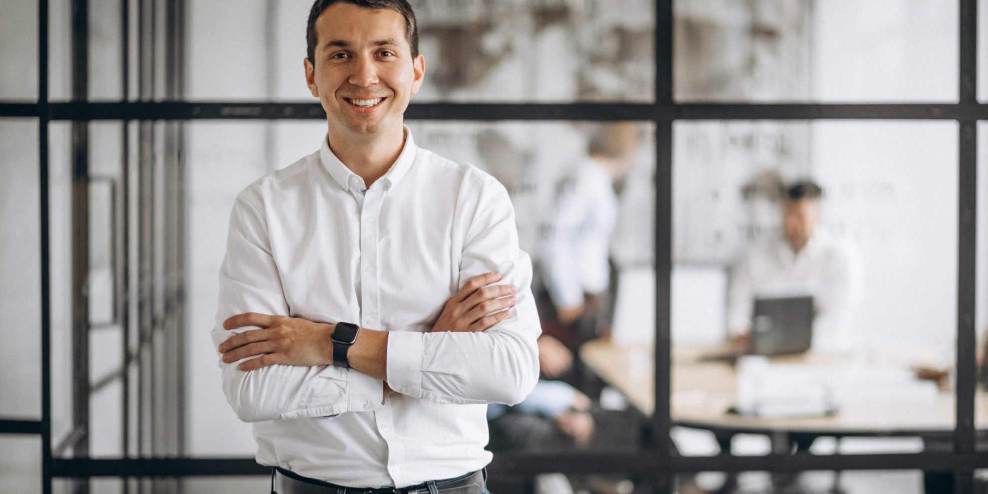 Photo of confident business owner illustrates blog: "How to Stand Out as an Employer"