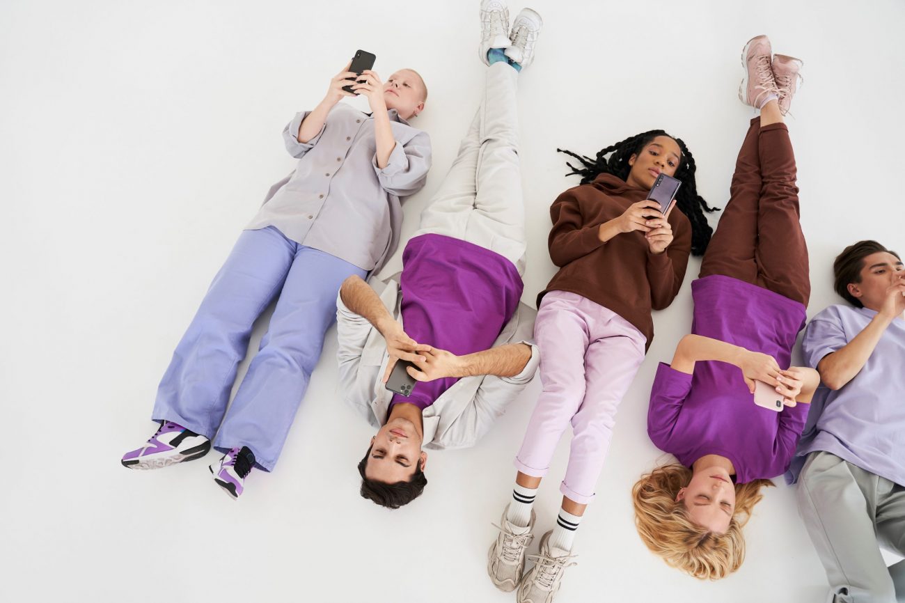 gen-z-FP Young people lying on the ground illustrate blog "How to Retain Gen Z Employees"