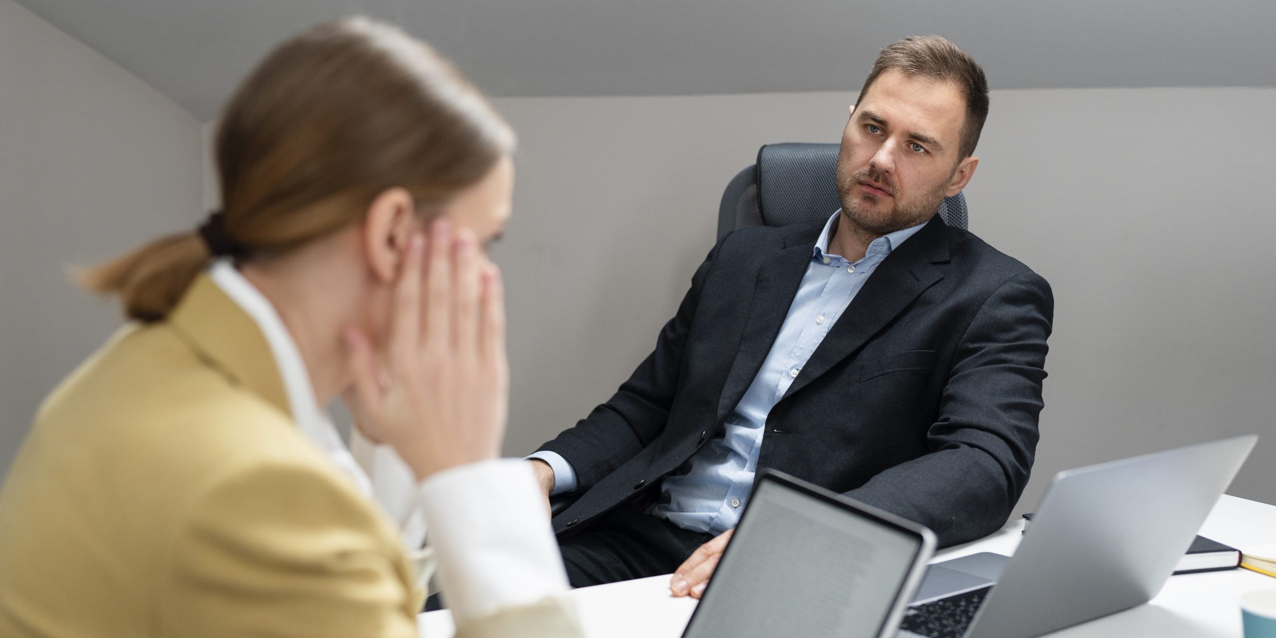 Man and woman in office during job interview.