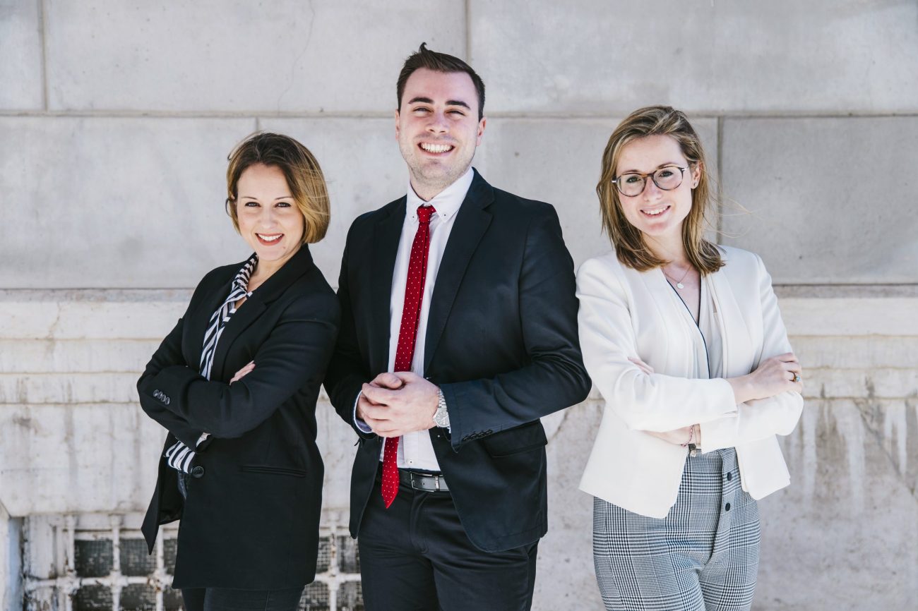 executives2-fp Three smiling office workers.