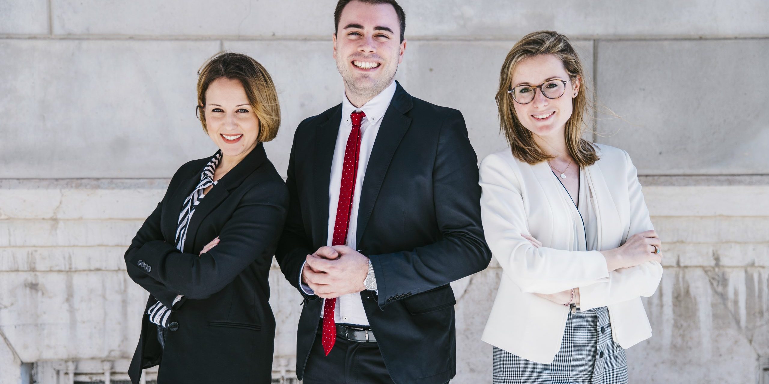 Three smiling office workers.