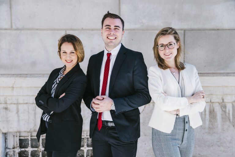 Three smiling office workers.