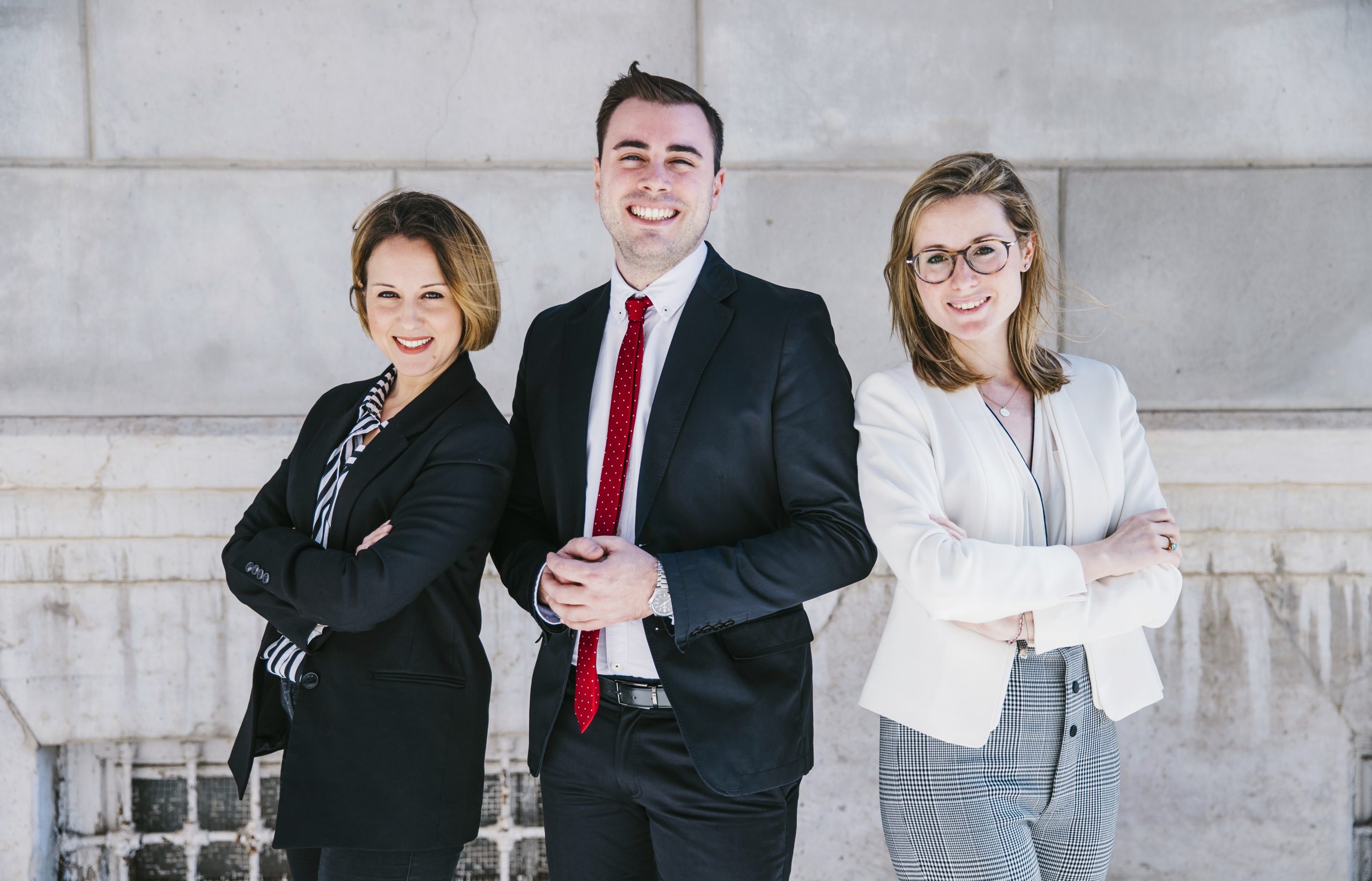 Three smiling office workers.